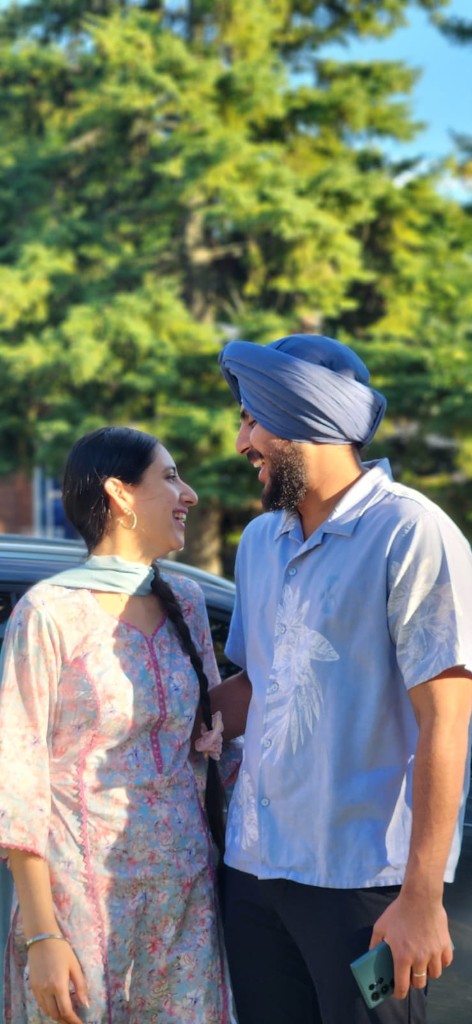 Kamal and Ishmeet smiling at each other