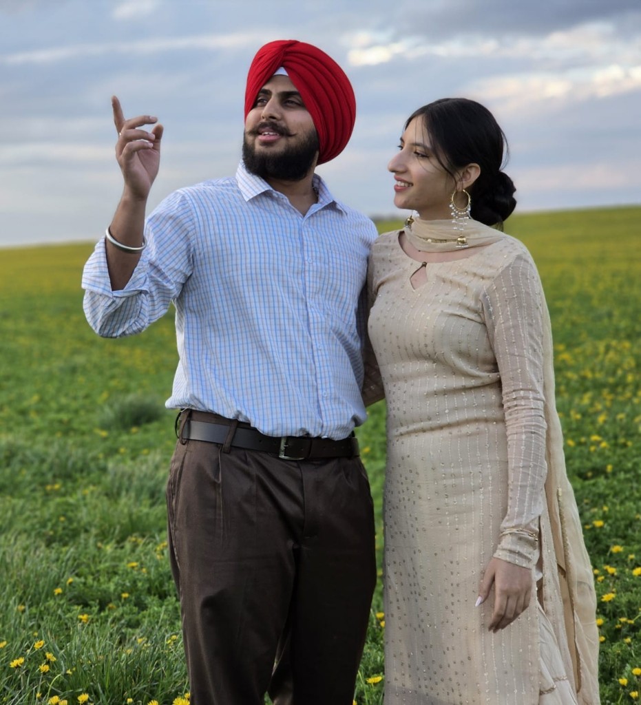 Kamal and Ishmeet in a field of yellow flowers